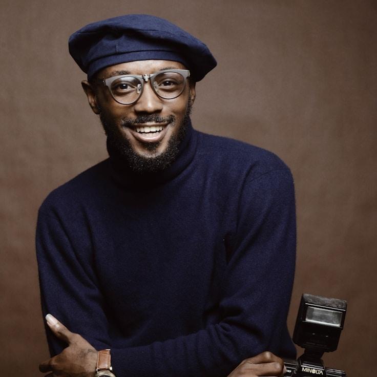 Avery Chen, Lead Design Curator at Beacon Parcel Hub, reviewing corporate floral arrangements